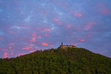 Obraz premium Germany, Scenic view up to ancient castle teck in swabian alb or swabian jura landscape in romantic orange sunset light
