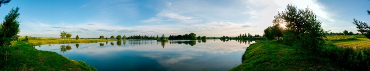 Fototapeta na wymiar colorful panorama of autumn lake on a bright sunny day