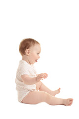 Sweet little girl sitting isolated on white background