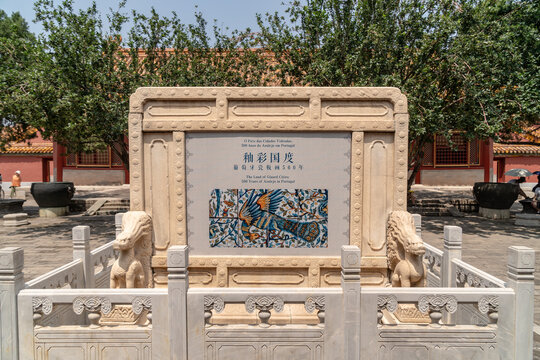 Fragment of peacock wall with glazed ceramic white tiles, with color painted scene. Traditional Portuguese architecture heritage in Chinese museum. 