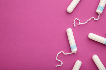 Menstrual tampons on a pink background. Cotton tampon for women