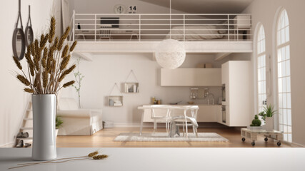 White table top or shelf with straws, dry plants, ornament, ears, sheaf, branch in vase, over wooden and white kitchen with accessories, mezzanine, modern minimal interior design