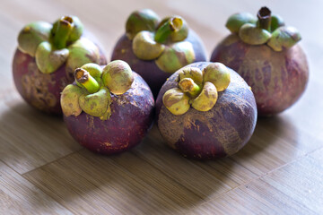 Fototapeta premium Mangosteen nine viewed from above. Fruit with purple skin, white and sour fruits are nutritious