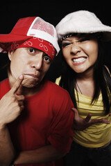 Young man and woman making faces