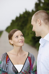 Fototapeta premium Woman smiling and looking at man