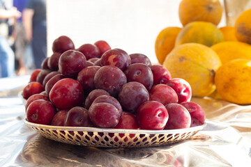 ripe plums on the shelves in the bazaar in Ukraine in summer