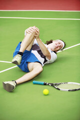 Fototapeta premium Man with knee injury while playing tennis