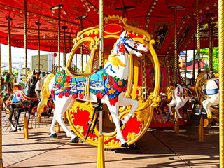 Sochi, Russia June 2020. Attraction in Sochi Park. Children's carousel with horses. Olympic Park. Quarantine, coronavirus. No people.