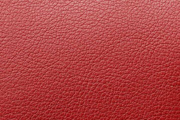 Red textured leather background. Abstract leather texture. Red natural leather texture, close up shot