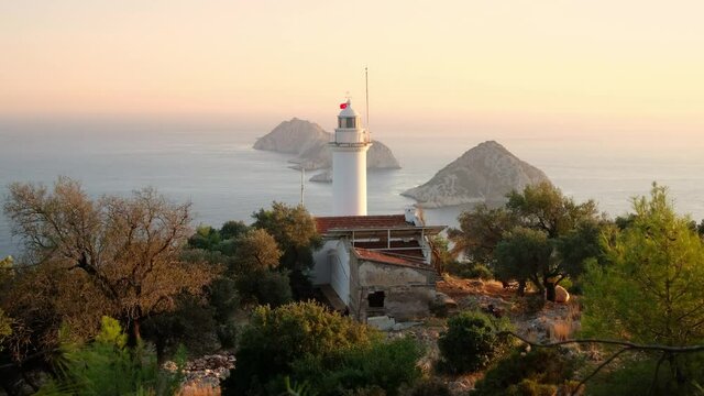 Lighthouse at Gelidonya cape in Mediterranean sea at sunset, Antalya.