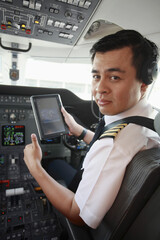 Pilot in private jet cockpit © ImageHit