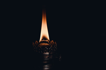 Burning fire in the dark from a lamp