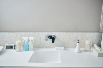 Obraz na płótnie Canvas Stylish bathroom interior with necessary items near the sink