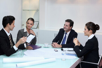 Business people in discussion at conference table