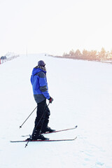 Man skiing on winter day