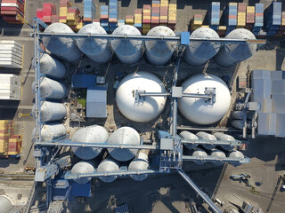 Aerial view oil terminal is industrial facility for storage of oil and petrochemical products ready for transport to further storage facilities.