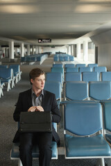 Businessman sitting in airport lounge