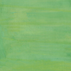 Strokes of tints of green gouache are on a paper. Texture