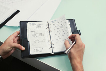 Businessman with pen and organizer