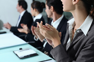 Business people clapping hands at meeting