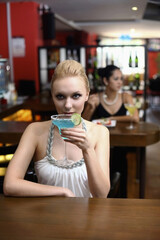 Woman drinking at a bar