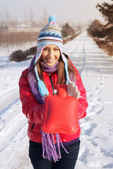 Woman holding hot water bottle