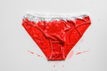 Women's red underwear on white background, concept photo for women's or feminist blog, ad women's apps