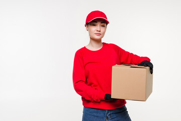 Delivery, relocation and unpacking. Smiling young woman holding cardboard box on white background