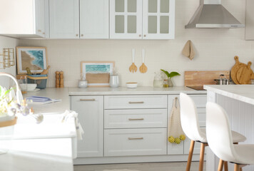 Fototapeta premium Beautiful kitchen interior with new stylish furniture