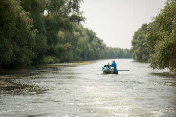 Boat on Danube river,  Danube delta area,  Romania,  in a sunny summer day