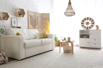 Comfortable white sofa in modern room. Interior design