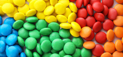 Many colorful candies as background, top view. Banner design