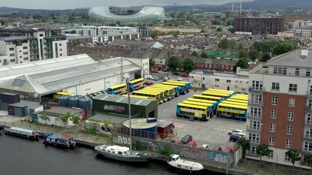 Dublin busses yellow double decker in Ireland. Aerial view of Dublin bus station by drone. 