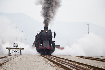 Old Steam train - locomotive is leaving the Railway Station at Nova Gorica, Slovenia