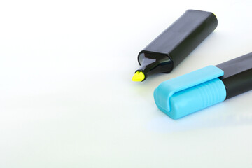 blue and yellow highlighters. Isolated on white background