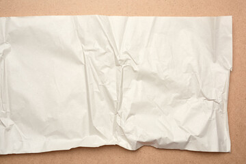 crumpled blank sheet of gray wrapping kraft paper