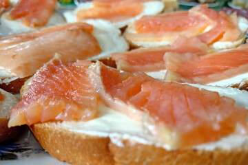 Sandwiches with juicy tasty trout close-up.