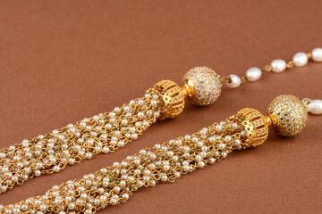 Pearl Jewelry on a brown background,  Pearl bracelet,  pearl necklace, pearl earrings.Style, fashion and design of jewelry. indian traditional jewellery