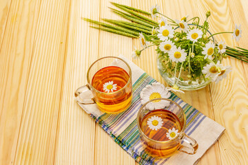 Chamomile tea. Fresh flowers, summer hot drink concept. Alternative medicine, lifestyle
