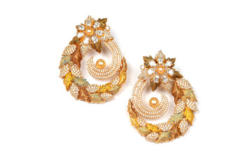 Fototapeta premium Glamorous antique Golden pair of earrings on white background. Luxury female jewelry, Indian traditional jewellery, kundan earring,Bridal Gold earrings wedding jewellery,Vintage earrings