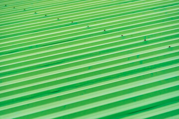 Green painted metal roof as an abstract background