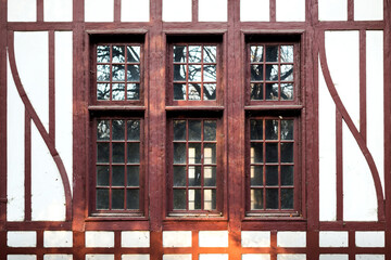 Old wooden window, with lines and curves.
