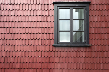 Window on red tile roof