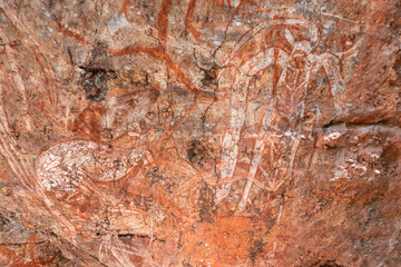 Aboriginal art. Anbangbang gallery. Paintings on a rock wall made with ochre. Sacred site. Meaning:...