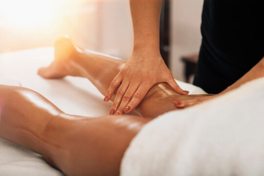 Anti Cellulite Massage. Masseuse Massaging a Female Calf