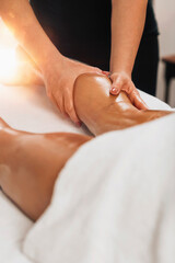Obraz na płótnie Canvas Anti Cellulite Massage. Masseuse Massaging a Female Calf