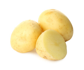 Whole and cut fresh raw organic potatoes on white background