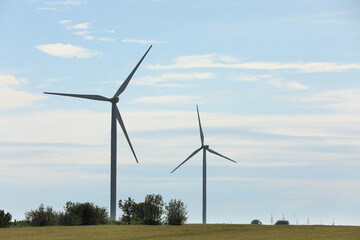 Beautiful view of field with wind turbines. Alternative energy source