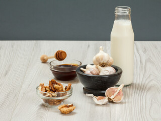 Health remedy relief foods for cold and flu on a gray wood boards.