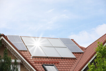 Fototapeta premium House with installed solar panels on roof